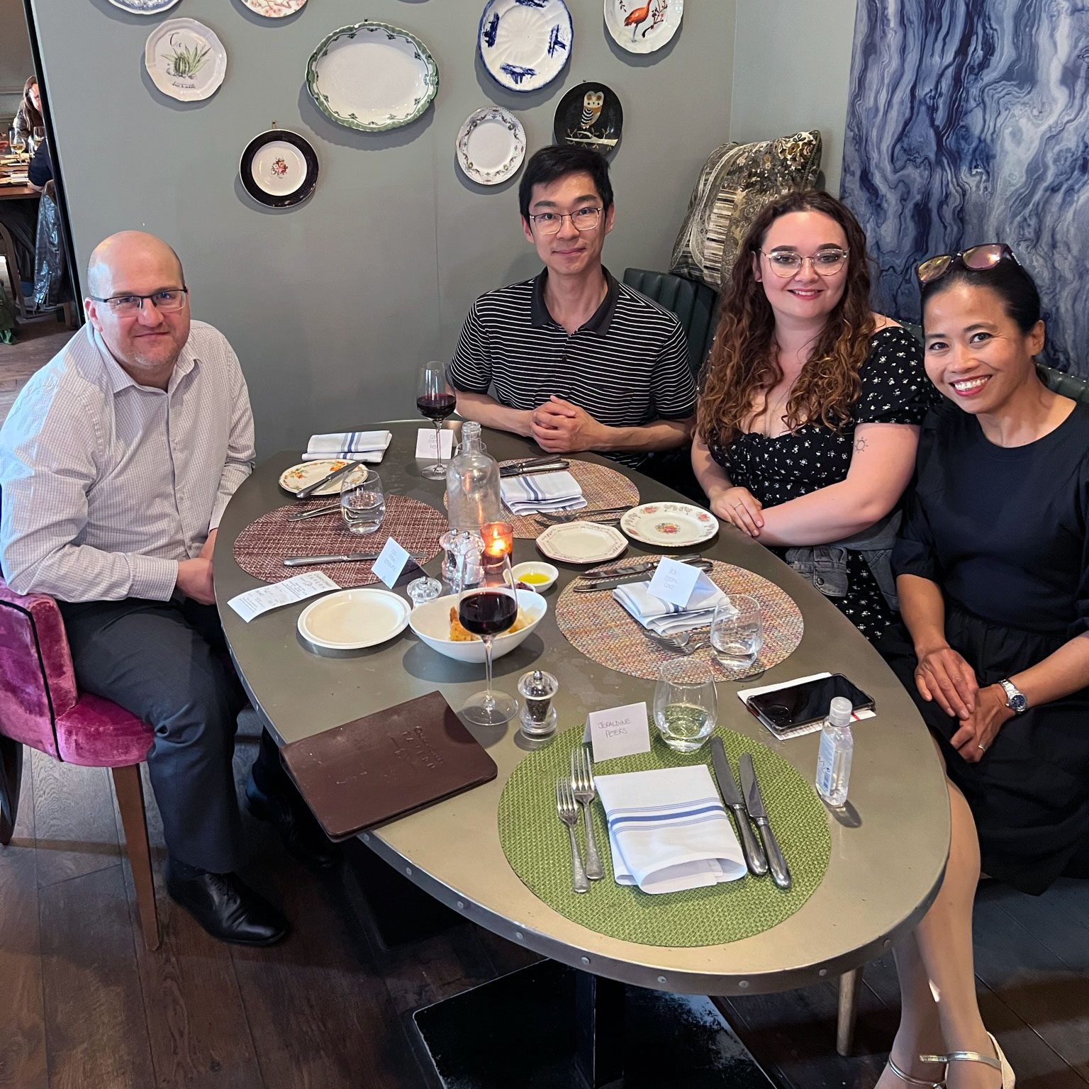 Employees seated together and ready to enjoy the meal